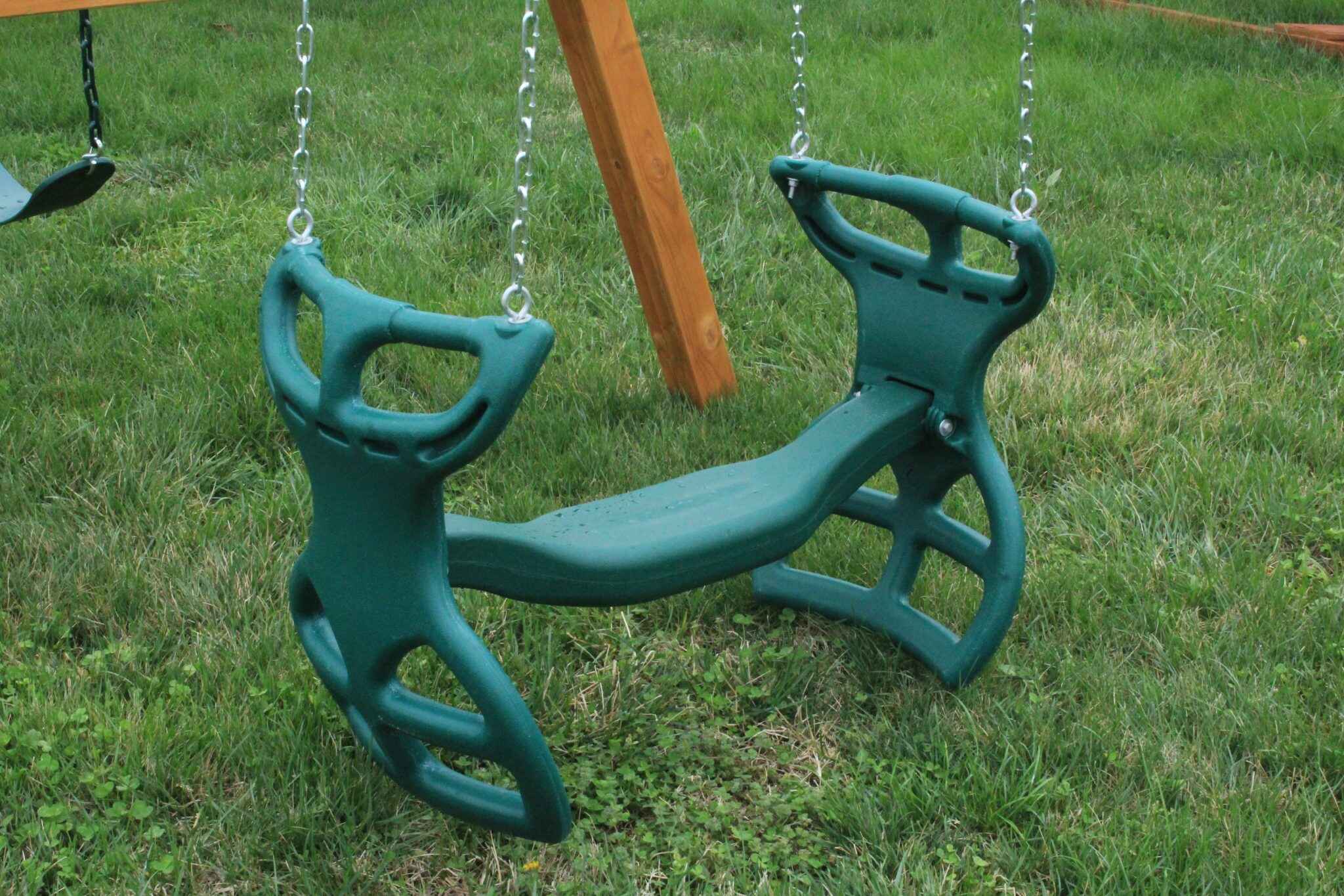 This two-person glider swing promotes social play and coordination. Features comfortable seats, sturdy handles, and smooth gliding action. The controlled back-and-forth motion provides a unique swinging experience.