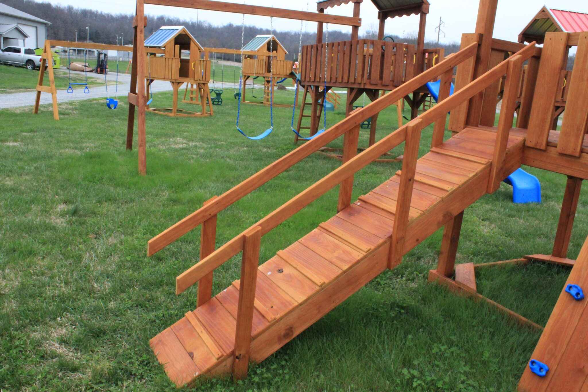 This inclined walking bridge adds adventure while maintaining safety with its full-length guardrails. The textured surface prevents slipping, and the sturdy construction handles multiple children.
