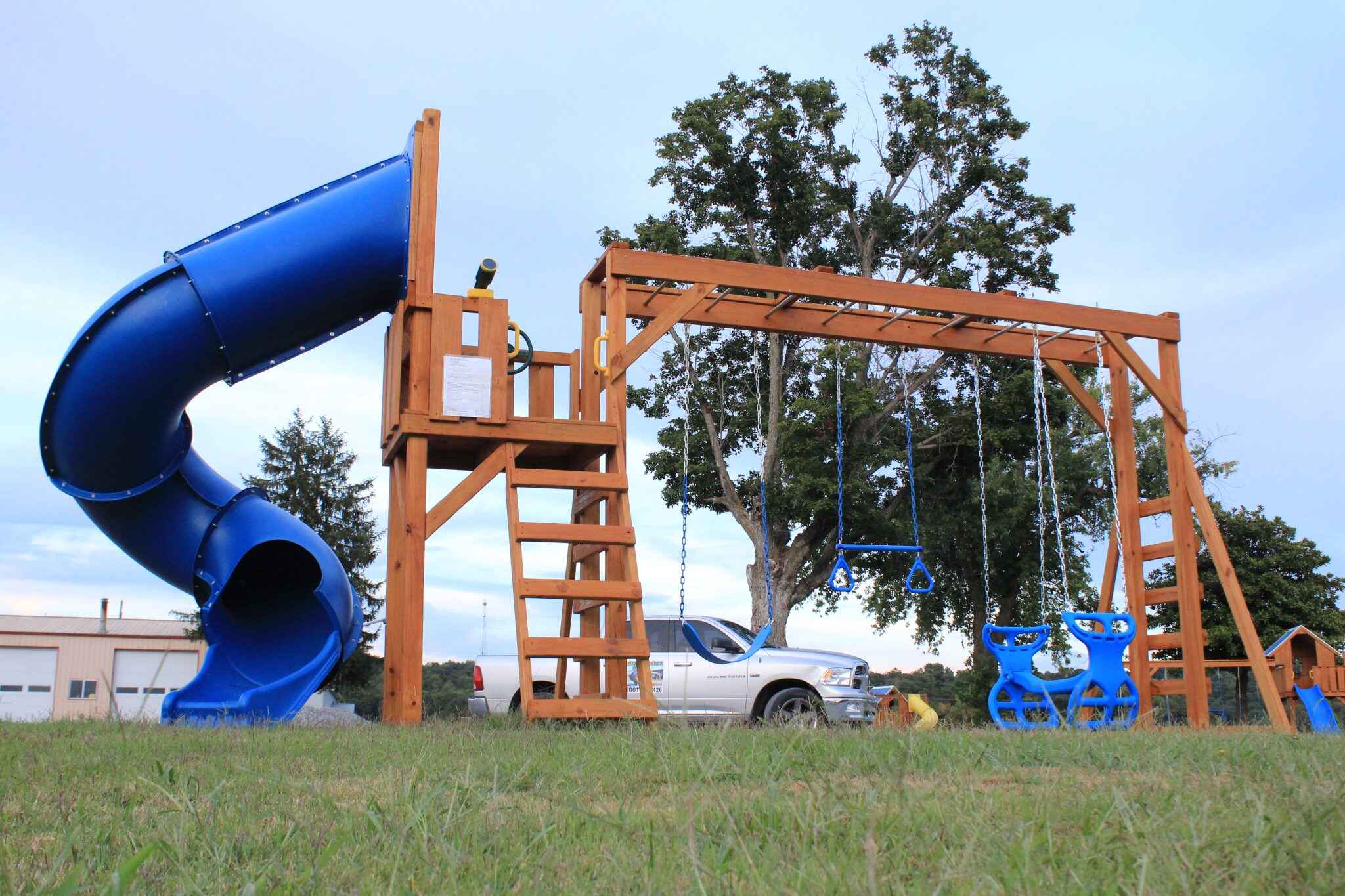 This open-air platform design maximizes play space and visibility. Without a roof, it offers unrestricted access for attachments on all sides and creates a versatile base for multiple activities. The open design allows for easy supervision and is perfect for areas with mature shade trees.