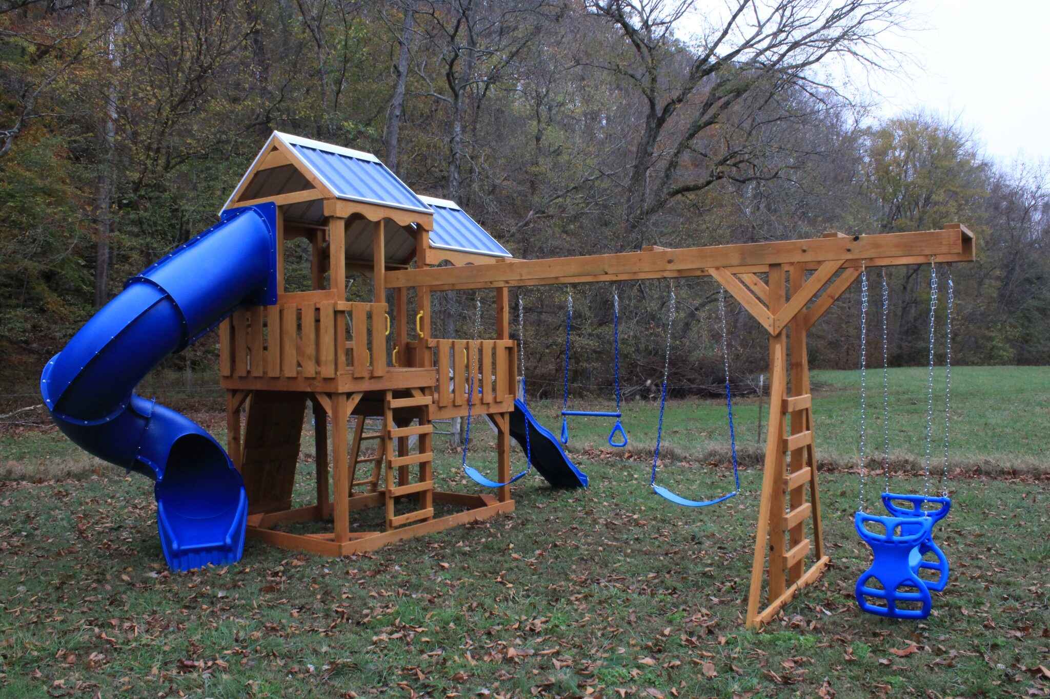 This innovative design features two connected decks at different heights under a single roof system. The split-level layout creates distinct play zones while maintaining a compact footprint. Perfect for multiple age groups, it allows younger and older children to play at their preferred heights.